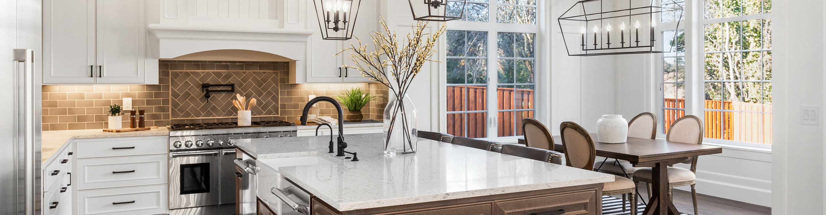 farmhouse style kitchen with white cabinets and dark wood look flooring