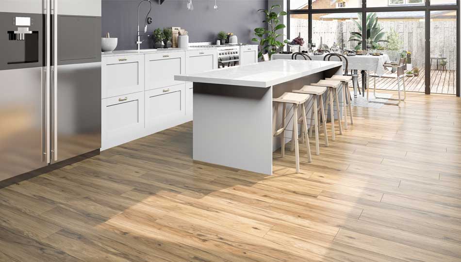 Modern white kitchen with grey walls and wood look flooring